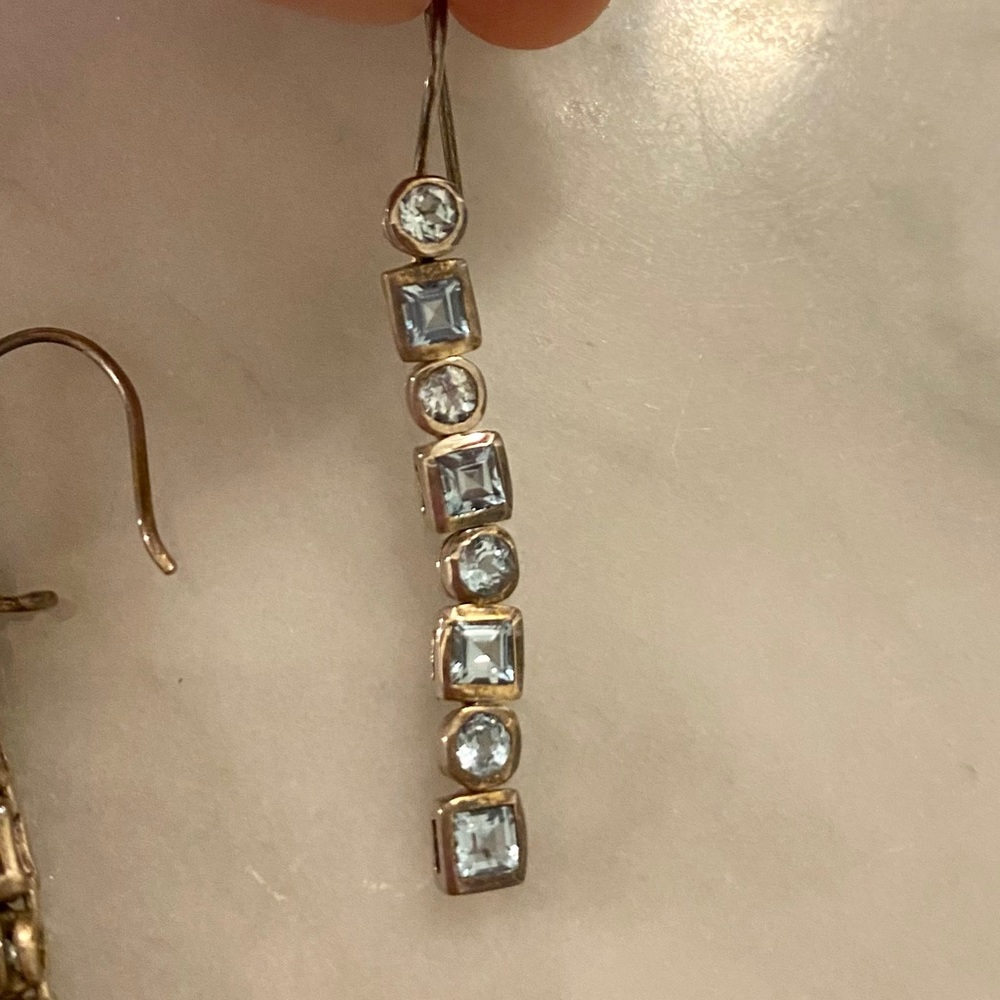 Blue jeweled dangling earrings